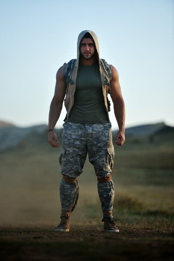 Athletic young man on dusty field in summer. Athletic young man on dusty field in summer