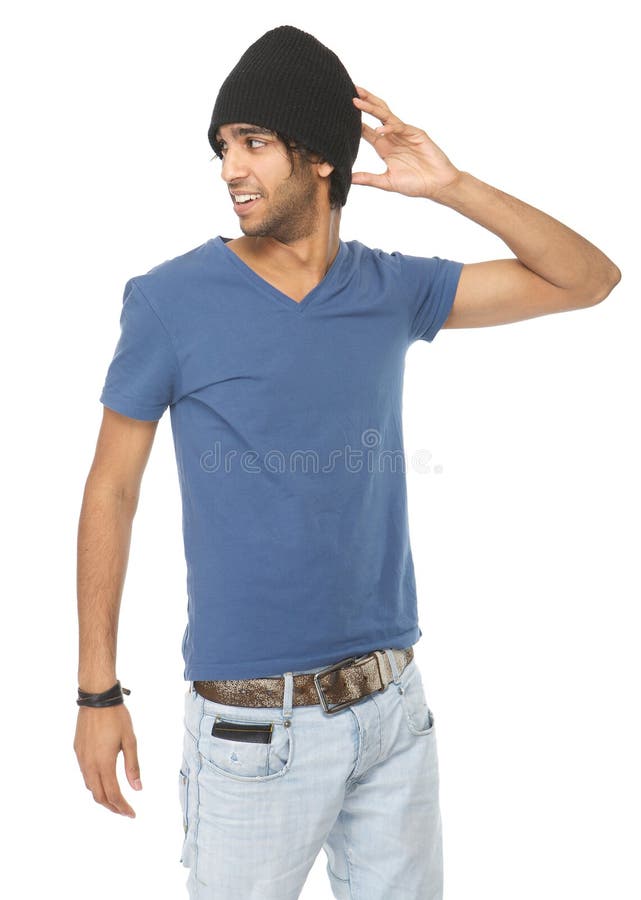 Jeune mannequin masculin dans les jeans et le chapeau noir photos libres de droits Jeune mannequin masculin dans les jeans et le chapeau noir photos libres de droits