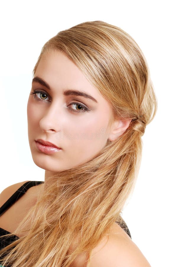 Jeune verticale blonde de côté de femme image libre de droits Jeune verticale blonde de côté de femme image libre de droits