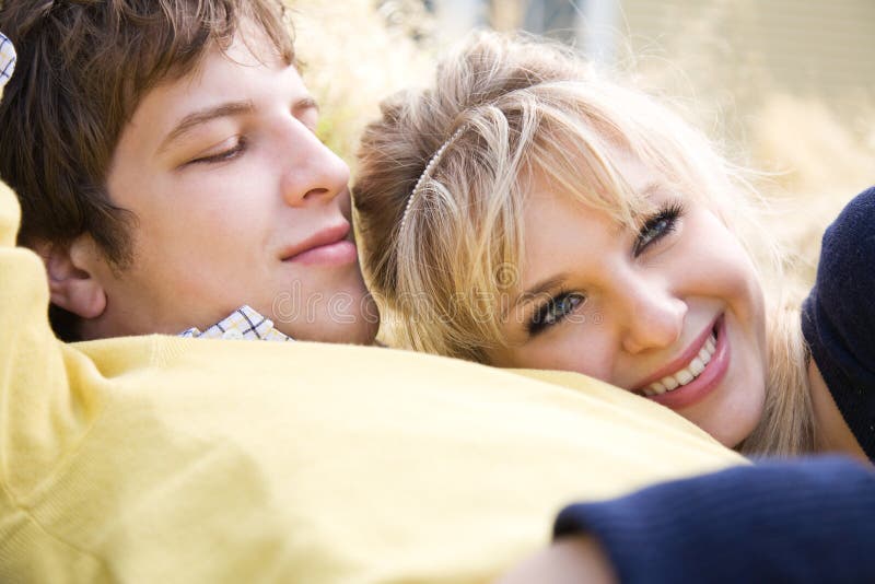 A shot of a young caucasian couple in love relaxing outdoor. A shot of a young caucasian couple in love relaxing outdoor