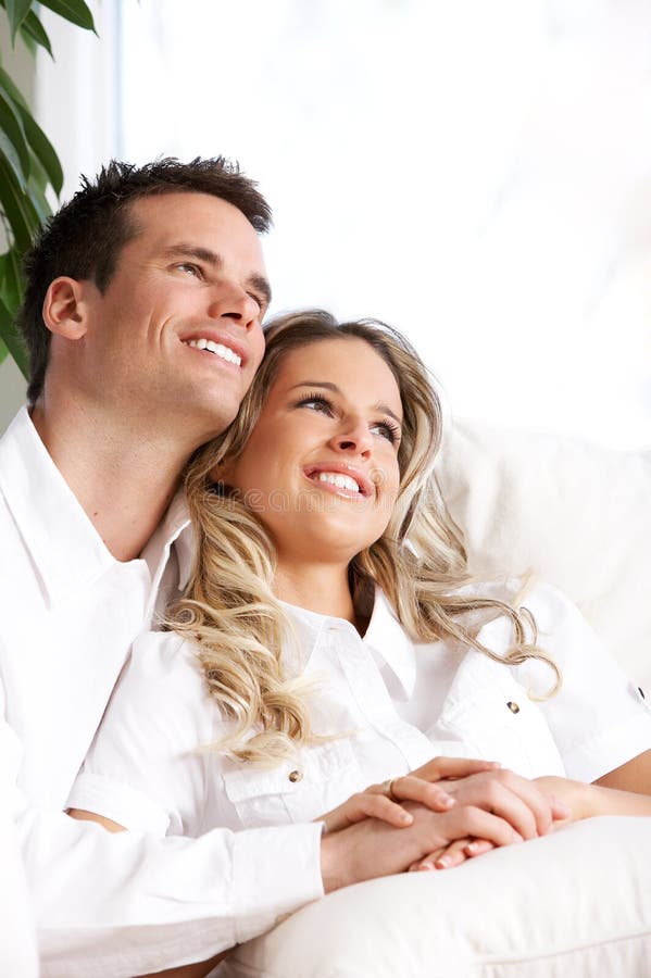 Young love couple smiling in the comfortable apartment. Young love couple smiling in the comfortable apartment