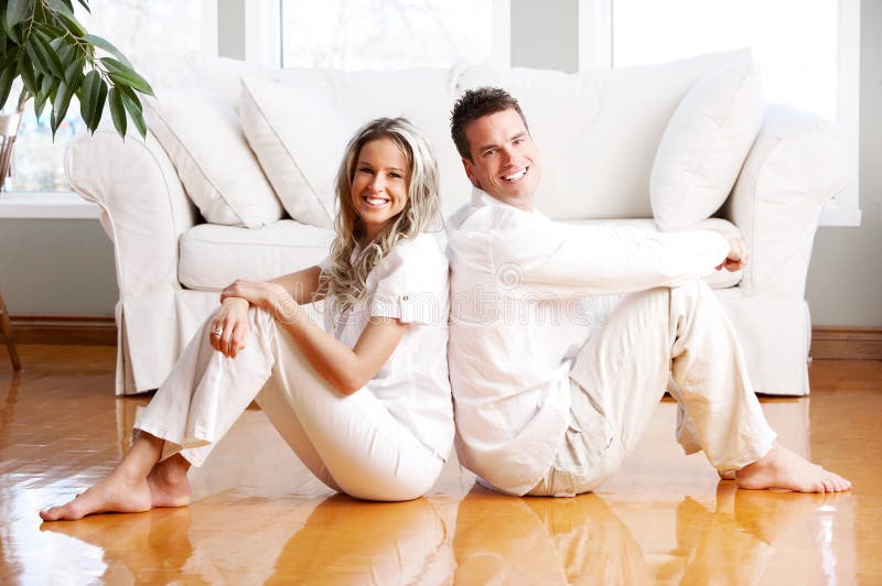 Young love couple smiling in the comfortable apartment. Young love couple smiling in the comfortable apartment