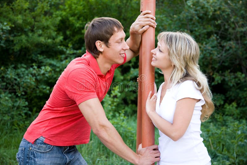 Portrait of a beautiful young couples are happily embracing at walk. Portrait of a beautiful young couples are happily embracing at walk