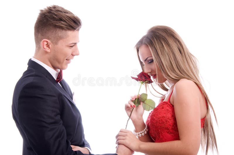 Jeunes couples réussis sur le fond blanc images stock Jeunes couples réussis sur le fond blanc images stock
