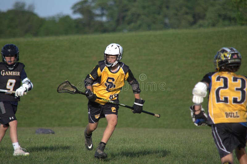 Jeunes joueurs de lacrosse photo libre de droits Jeunes joueurs de lacrosse photo libre de droits