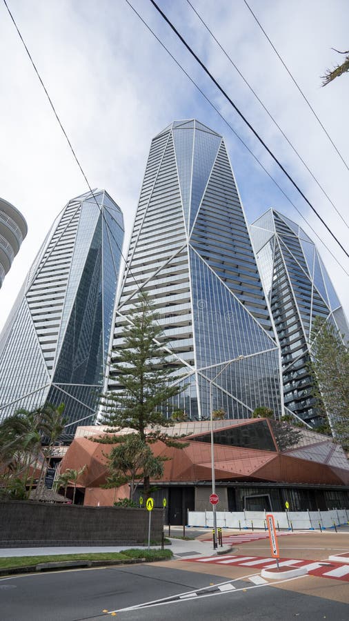 A view of the Jewel luxury apartments in Gold Coast in Australia. Jewel is a three-tower development located on Old Burleigh Road in Surfers Paradise. The three-tower development includes a three-level podium, a six-star hotel comprising 169 suites, and 512 one, two and three-bedroom apartments. Tower 1 right has 41 levels of apartments. Tower 2 middlehas 48 levels and is a 5-star hotel. Tower 3 left has 35 levels of apartments. A view of the Jewel luxury apartments in Gold Coast in Australia. Jewel is a three-tower development located on Old Burleigh Road in Surfers Paradise. The three-tower development includes a three-level podium, a six-star hotel comprising 169 suites, and 512 one, two and three-bedroom apartments. Tower 1 right has 41 levels of apartments. Tower 2 middlehas 48 levels and is a 5-star hotel. Tower 3 left has 35 levels of apartments.