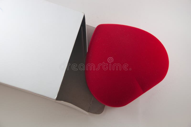 Red Jewel Box Heart Shaped Gift Present on Green Fabric Wavy Cloth