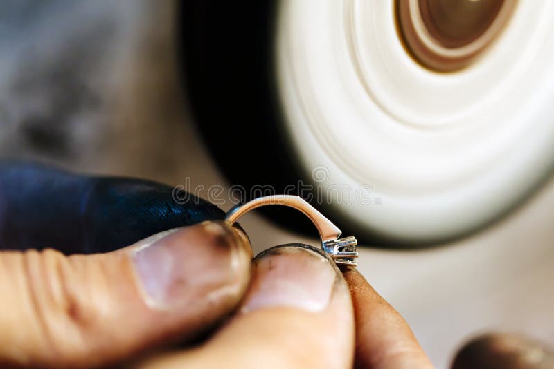 Jeweler polishing jewelry stock image. Image of delicate 62442895