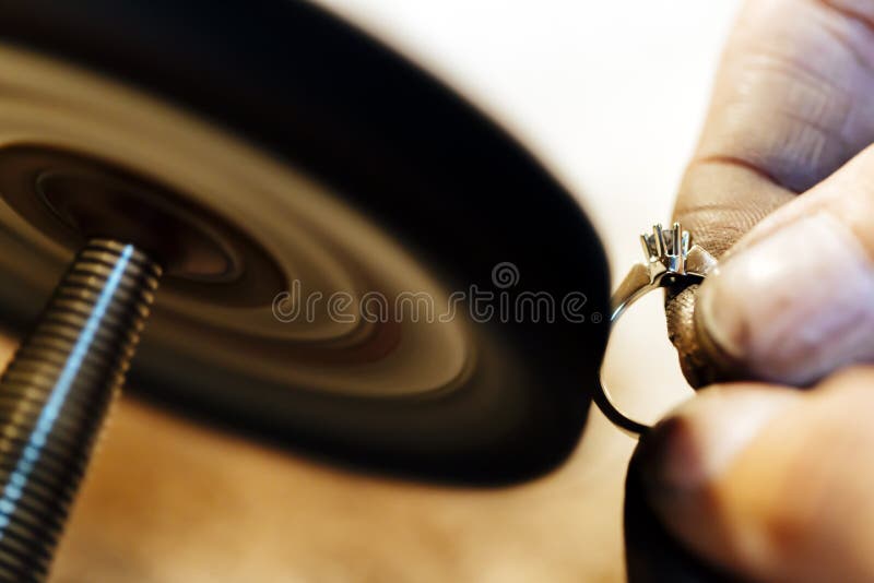 Jeweler polishing jewelry stock image. Image of holding 89815689