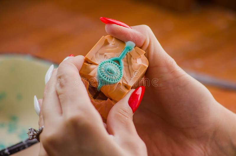 Jeweler working with wax model ring in his workshop. Craft jewelery making. Close up royalty free stock photo Jeweler working with wax model ring in his workshop. Craft jewelery making. Close up royalty free stock photo
