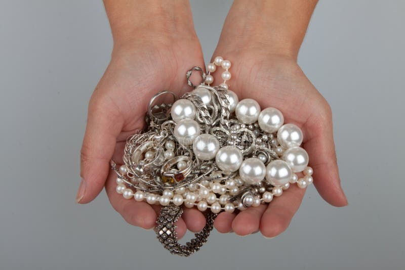 Jewelry in female hands stock photo. Image of jewelry 15986154