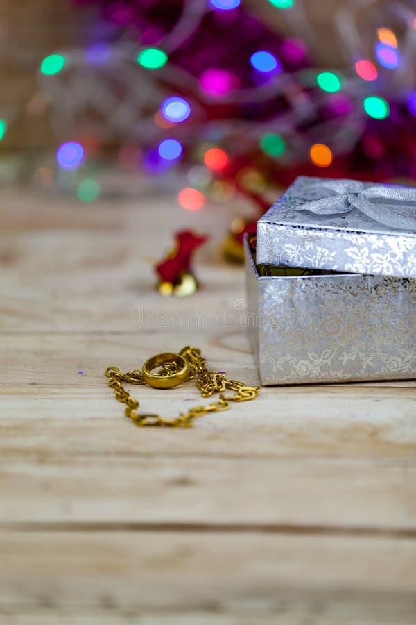 Jewelry, Gold Necklaces and Gold Rings Put on Gift Boxes. Stock Photo