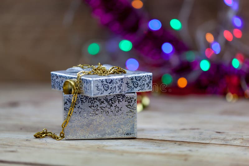 Jewelry, Gold Necklaces and Gold Rings Put on Gift Boxes. Stock Photo