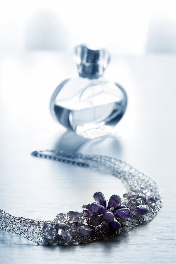 Jewelry and bottle of perfume. Jewelry and bottle of perfume