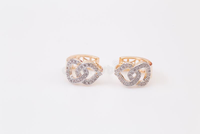 Jewelry red rose gold diamond earrings on the white background