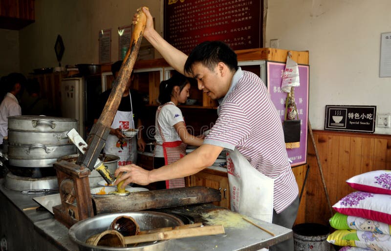 Jiezi, China: Worker Making Noodles