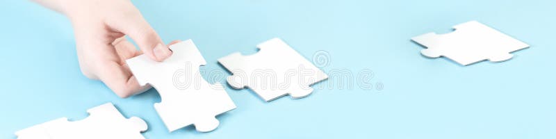 Jigsaw puzzle piece in a hand stock photo Jigsaw puzzle piece in a hand stock photo