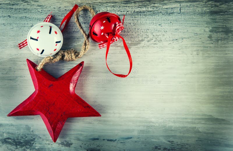 Jingle bells and wooden red star as christmas decorations