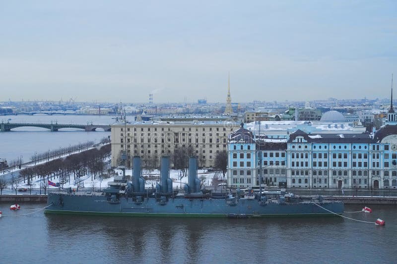 cruiser Aurora in St. Petersburg in snow and ice on the background of the city. cruiser Aurora in St. Petersburg in snow and ice on the background of the city