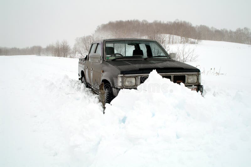 Jeep has stuck in snowdrift on snow road. Jeep has stuck in snowdrift on snow road