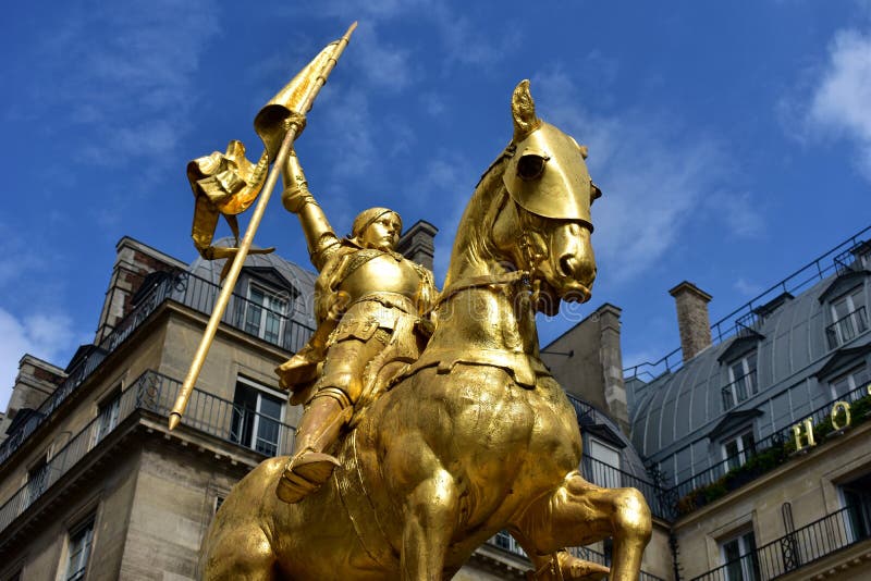 Paris, France. Joan of Arc (Jeanne d’Arc) golden statue. Blue sky with white clouds. royalty free stock photo Paris, France. Joan of Arc (Jeanne d’Arc) golden statue. Blue sky with white clouds. royalty free stock photo