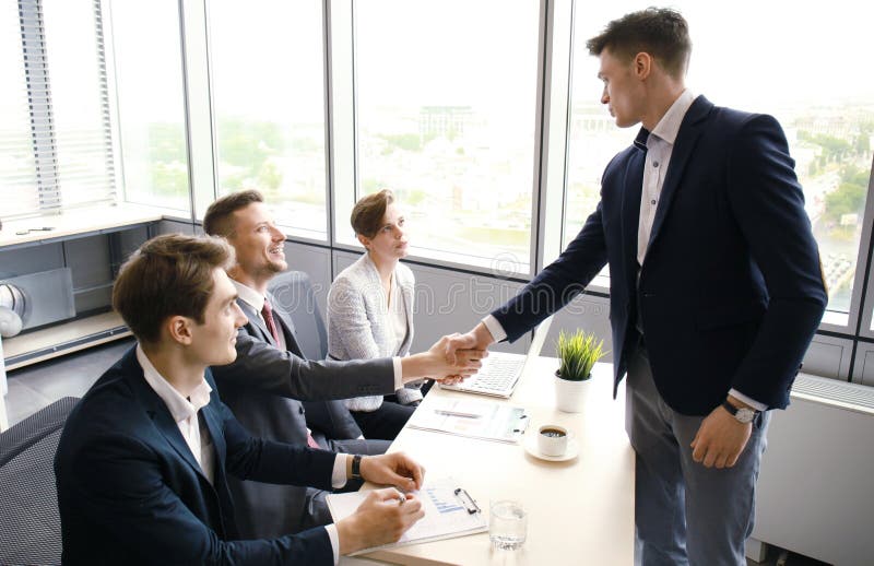 Job applicant having interview. Handshake while job interviewing. royalty free stock photography