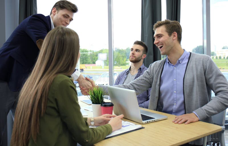 Job applicant having interview. Handshake while job interviewing. stock photo
