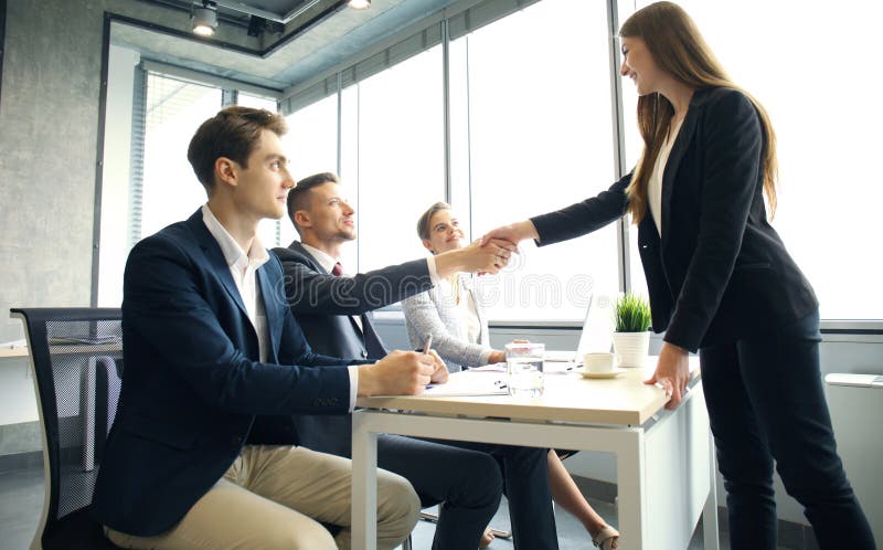 Job applicant having interview. Handshake while job interviewing.