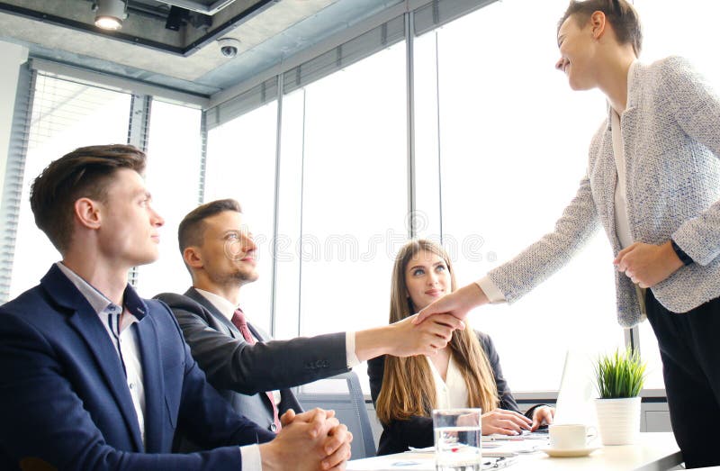 Job applicant having interview. Handshake while job interviewing. stock image