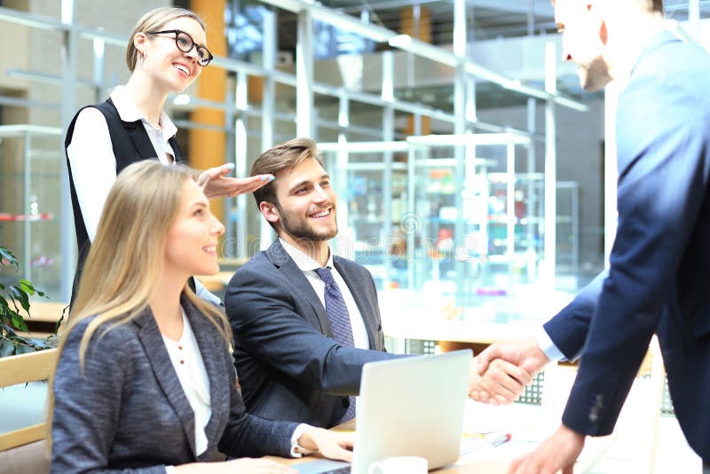 Job applicant having interview. Handshake while job interviewing stock image