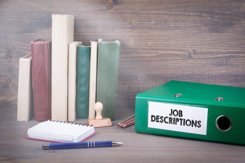 Job Descriptions. Binder On Desk In The Office. Business Backgroundr