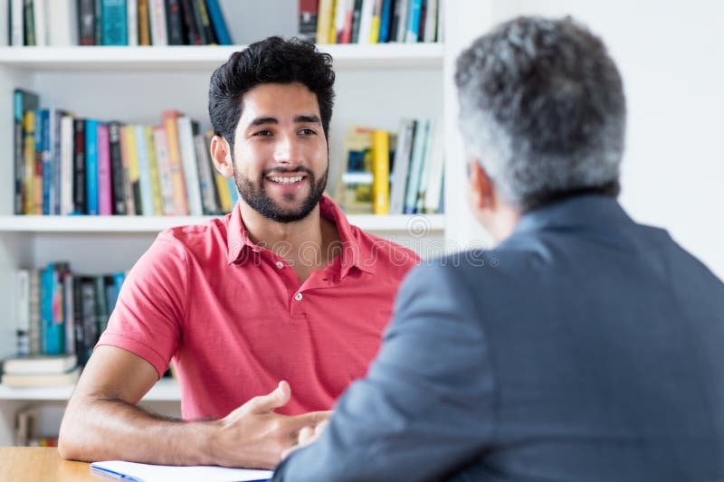 Job interview of brazilian male apprentice stock photo