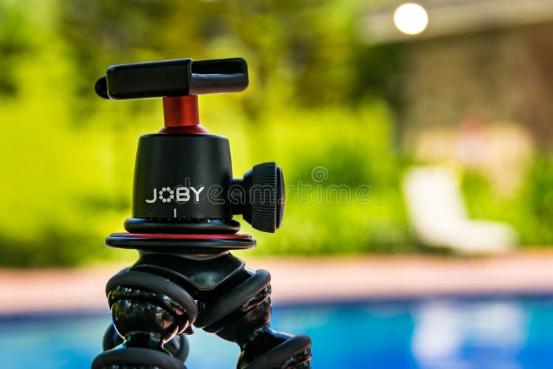 Guayaquil, Guayas / Ecuador - March, 02 2019: A Joby gorilla stand on a blurred garden background without a camera mounted on. Guayaquil, Guayas / Ecuador - March, 02 2019: A Joby gorilla stand on a blurred garden background without a camera mounted on.