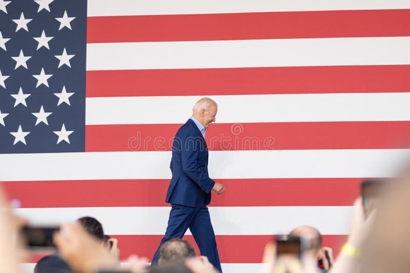 Joe Biden walking on stage at a campaign rally for Terry McAuliffe in Arlington Virginia. Joe Biden walking on stage at a campaign rally for Terry McAuliffe in Arlington Virginia.