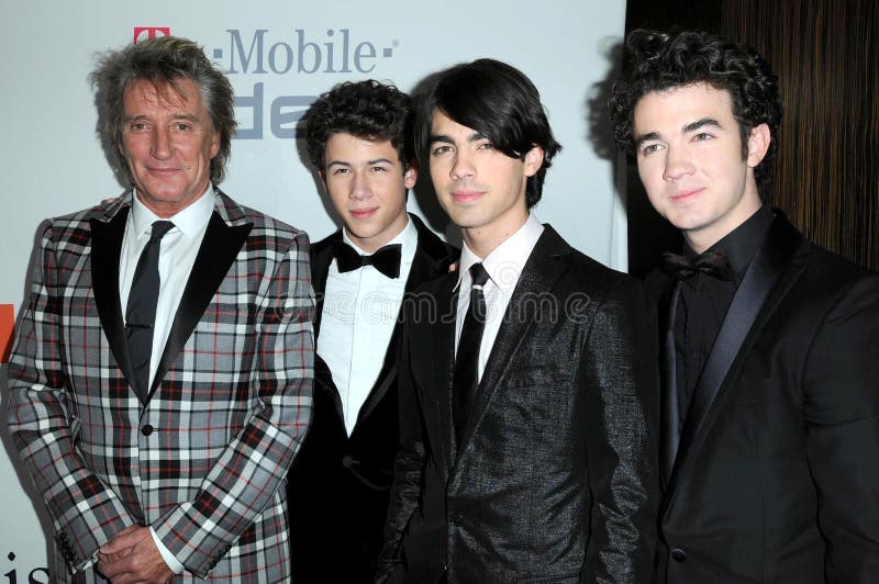 Rod Stewart and Nick Jonas with Joe Jonas and Kevin Jonas at the Salute To Icons Clive Davis Pre-Grammy Gala. Beverly Hilton Hotel, Beverly Hills, CA. 02-07-09. Rod Stewart and Nick Jonas with Joe Jonas and Kevin Jonas at the Salute To Icons Clive Davis Pre-Grammy Gala. Beverly Hilton Hotel, Beverly Hills, CA. 02-07-09