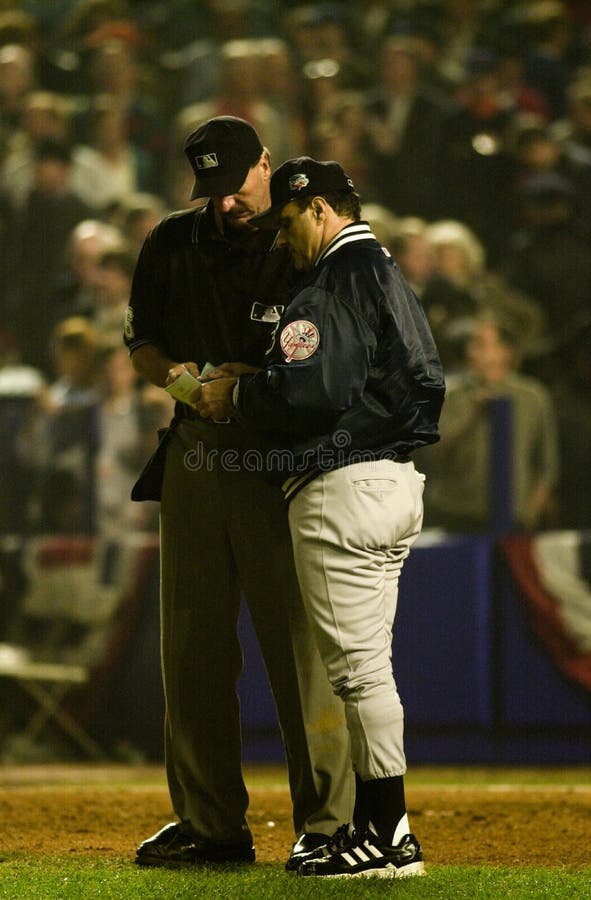 Yankees manager Joe Torre goes over the line up with home plate umpire Tim McClelland. (Image taken from color slide.)