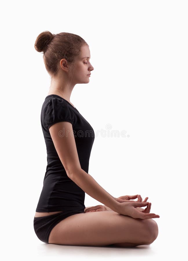 Young woman engaged in yoga on the floor. Young woman engaged in yoga on the floor