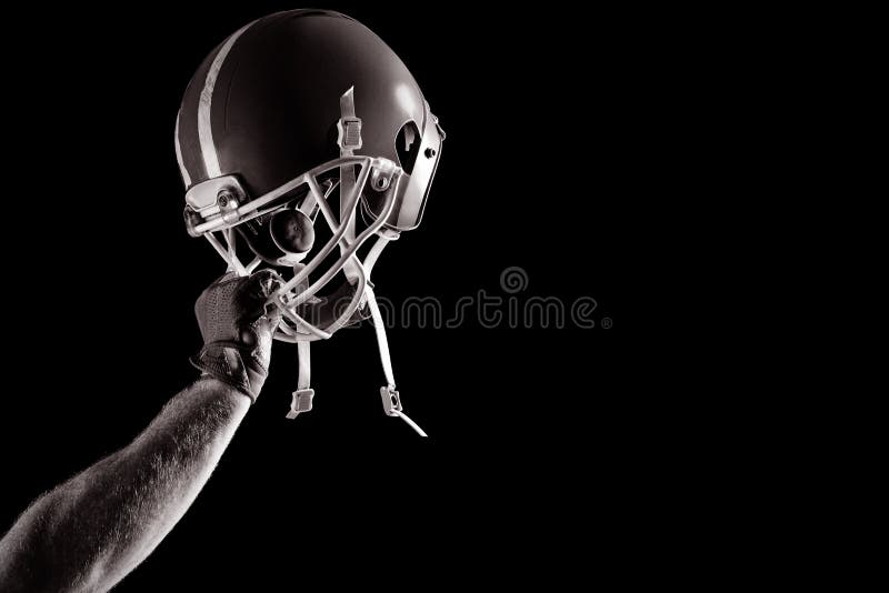 Jogador de futebol americano que cheering com braço acima imagens de stock royalty free Jogador de futebol americano que cheering com braço acima imagens de stock royalty free
