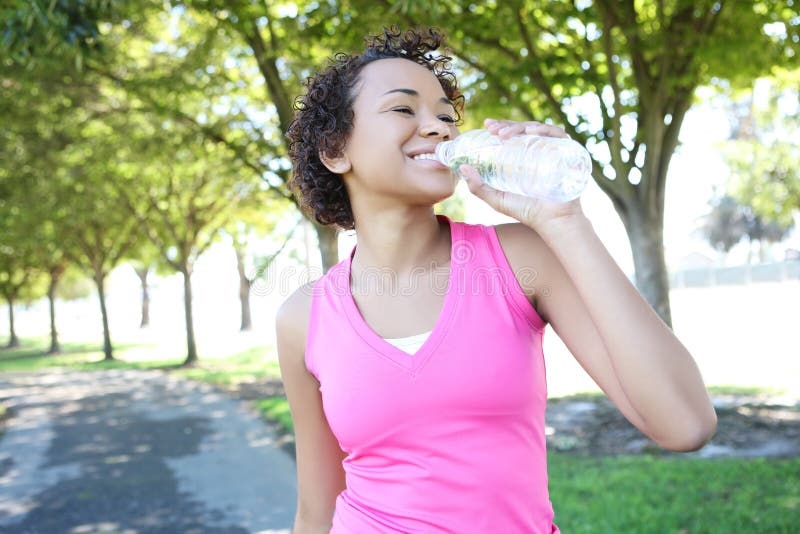 Jogger Drinking Water in Park