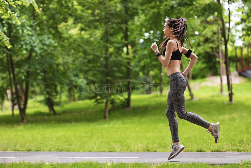 Woman jogging in the park  Women, Jogging, Girl short hair