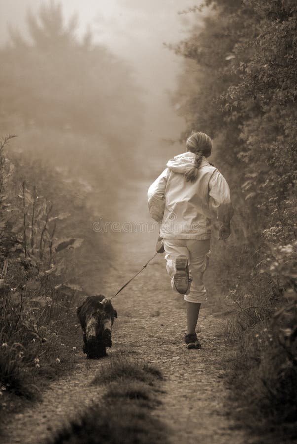 Jogging with dog stock photo. Image of trail, walk, mist 2629302