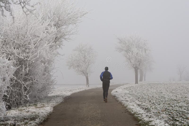 Jogging in winter fog stock image. Image of frost, person 83508651