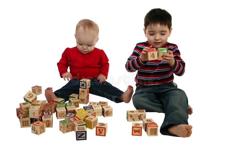 Brother and sister playing with alphabet blocks over white. clipping path included. Brother and sister playing with alphabet blocks over white. clipping path included.