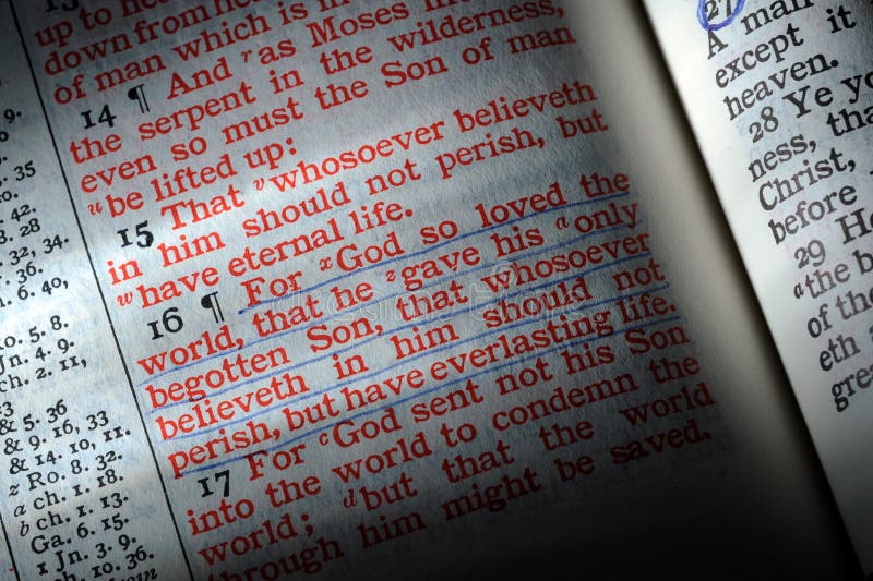 Bible is opened to John 3:16, highlighted by a beam of light.