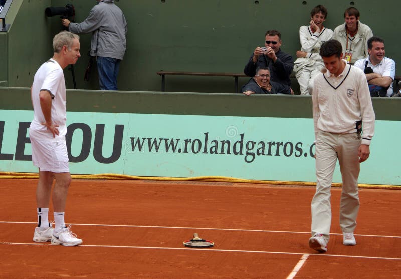 JUNE 1: Retired tennis legend John McEnroe is angry against the referee and throws his racket while playing tennis at the Roland Garros Open on June 1, 2008 in Paris, France.