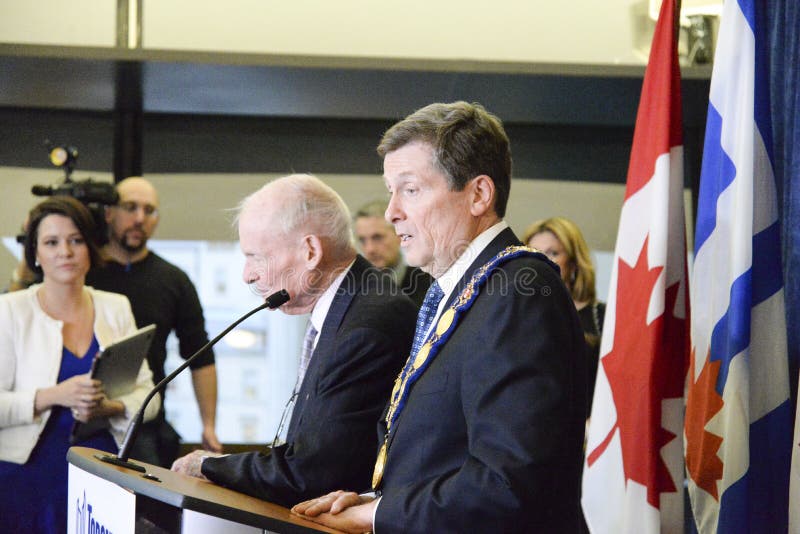 Mayor John Tory is seen standing alongside former Ontario premier Bill Davis, speaking with reporters after the mayor's inaugural council meeting. Mayor John Tory is seen standing alongside former Ontario premier Bill Davis, speaking with reporters after the mayor's inaugural council meeting.