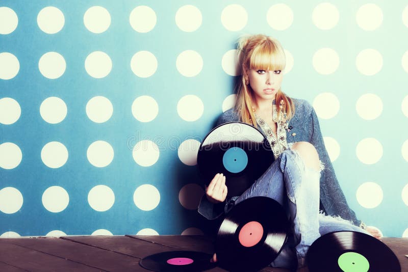 Portrait of a young girl with vinyl records in the hands. Portrait of a young girl with vinyl records in the hands