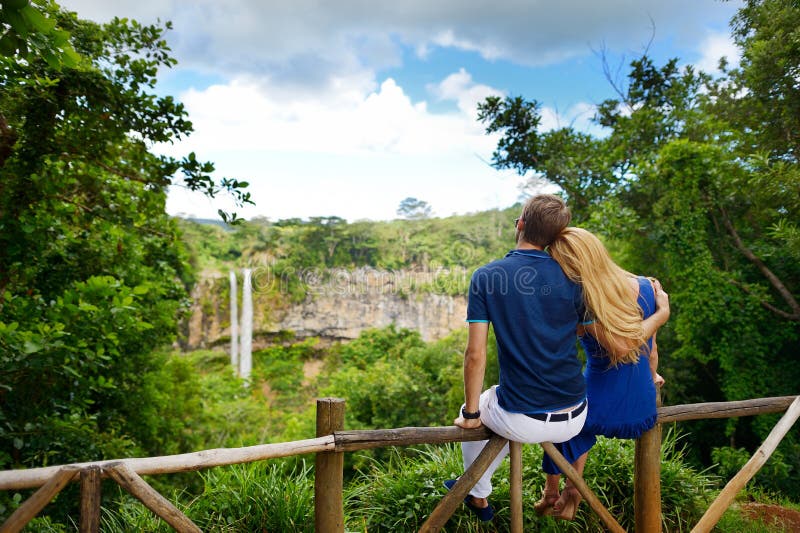 Young couple enjoying perfect view on Chamarel falls of Mauritius. Young couple enjoying perfect view on Chamarel falls of Mauritius