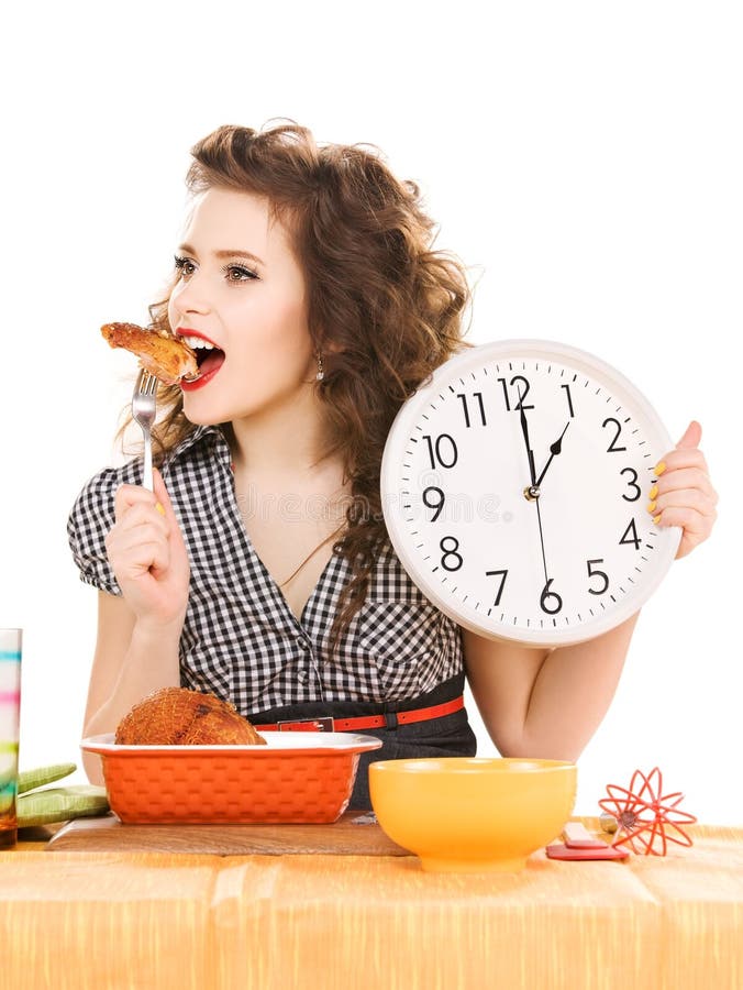 Jonge aantrekkelijke vrouw in de keuken stock fotografie Jonge aantrekkelijke vrouw in de keuken stock fotografie