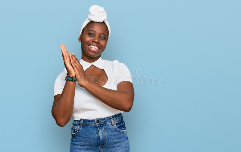Young african woman with turban wearing hair turban over isolated background clapping and applauding happy and joyful, smiling proud hands together. Young african woman with turban wearing hair turban over isolated background clapping and applauding happy and joyful, smiling proud hands together